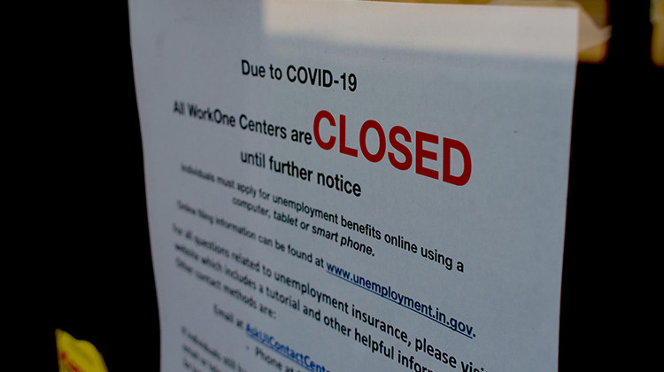 A local WorkOne employment office displays a sign on the front door saying it's closed due to COVID-19.  - Justin Hicks/IPB News