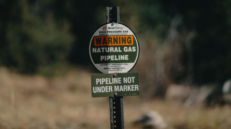 A sign for an Xcel Energy natural gas pipeline buried underground in Colorado, 2018. - Tony Webster/Flickr