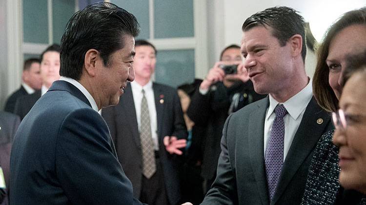 Japanese Prime Minister Shinzo Abe greets Sen. Todd Young, R-Ind., right, at the U.S. Chamber of Commerce in Washington, Friday, Feb. 10, 2017.  - AP Photo/Andrew Harnik
