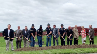 Representatives from the Indiana State Police and the city of Greenwood complete the ceremonial ground breaking for the new aviation hangar at Indy South Greenwood Airport on Monday, June 24, 2019. - Doug Jaggers/WFYI