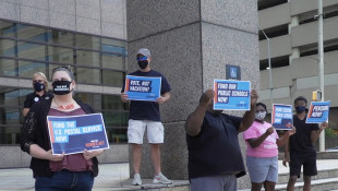 Labor Leaders Rally For HEROES Act Outside Offices Of Senators Braun, Young