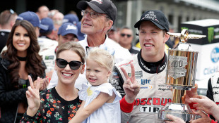 NASCAR Cup Series driver Brad Keselowski (2) celebrates with his wife Paige and daughter Scarlett after winning the NASCAR Brickyard 400 auto race at Indianapolis Motor Speedway, in Indianapolis Monday, Sept. 10, 2018. - AP Photo/Michael Conroy