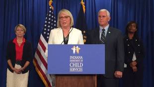 The Latest: Holcomb Disputes Child Welfare Chief's Claims 