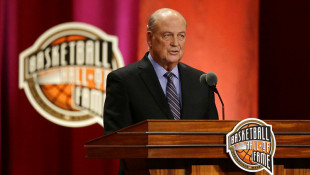 NCAA adminstrator Tom Jernstedt speaks during his enshrinement into the Naismith Memorial Basketball Hall of Fame on Friday, Sept. 8, 2017, in Springfield, Mass. - AP Photo/Stephan Savoia