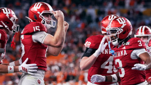Indiana completes undefeated season and wins 1st national title, beating Miami 27-21 in College Football Playoff final