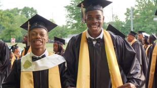 "You about to graduate high school, you have to be hyped," said Lyriq Spencer before he and Bernard Spencer, left, walked into Arlington Community High School on Thursday, June 7, 2018 for the 2018 commencement ceremony. - Eric Weddle/WFYI