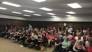 Pro-life and pro-choice supporters wait for the South Bend Common Council meeting to begin on Monday. - Barb Anguiano/WVPE