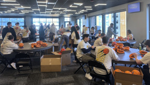 Volunteers honor local sports leader Jim Morris during March Madness preparations