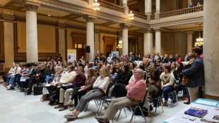 More than 100 advocates, including many high school students, pushed for legislation that would enforce harsher penalties for retailers that sell tobacco products to youth. - Darian Benson/IPB News
